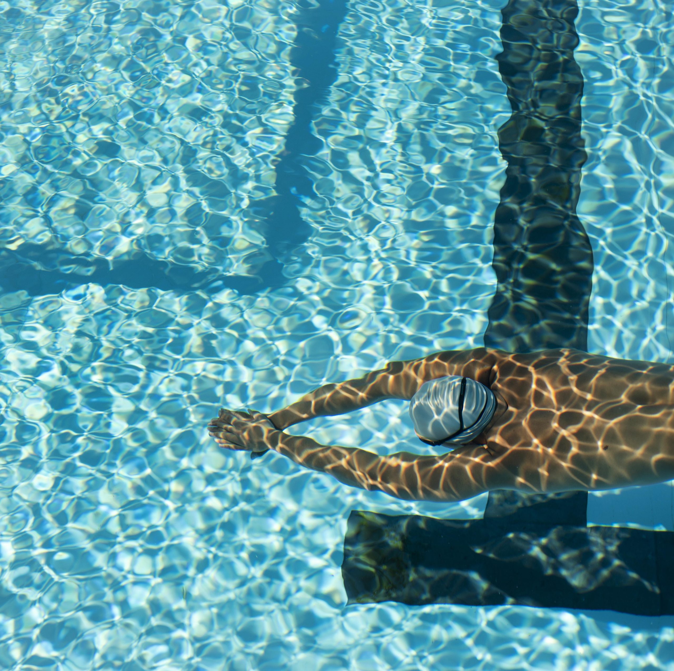 high-angle-male-swimmer-swimming-water-pool